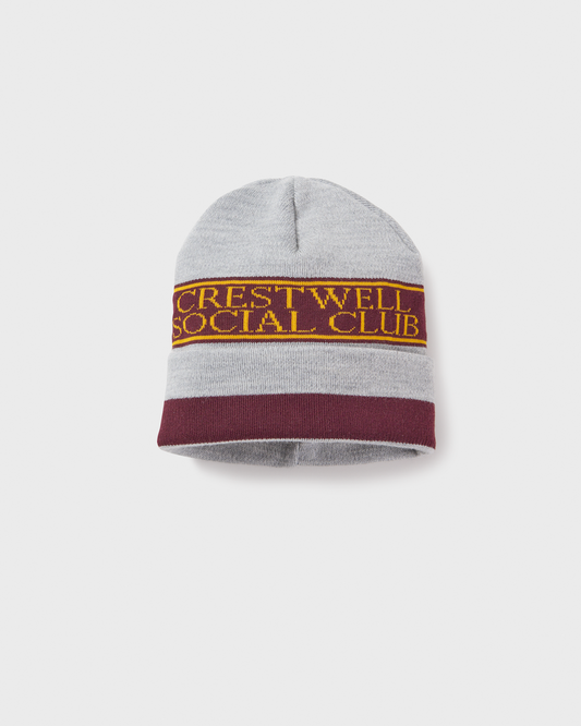 Beanie in grey, burgundy and gold.